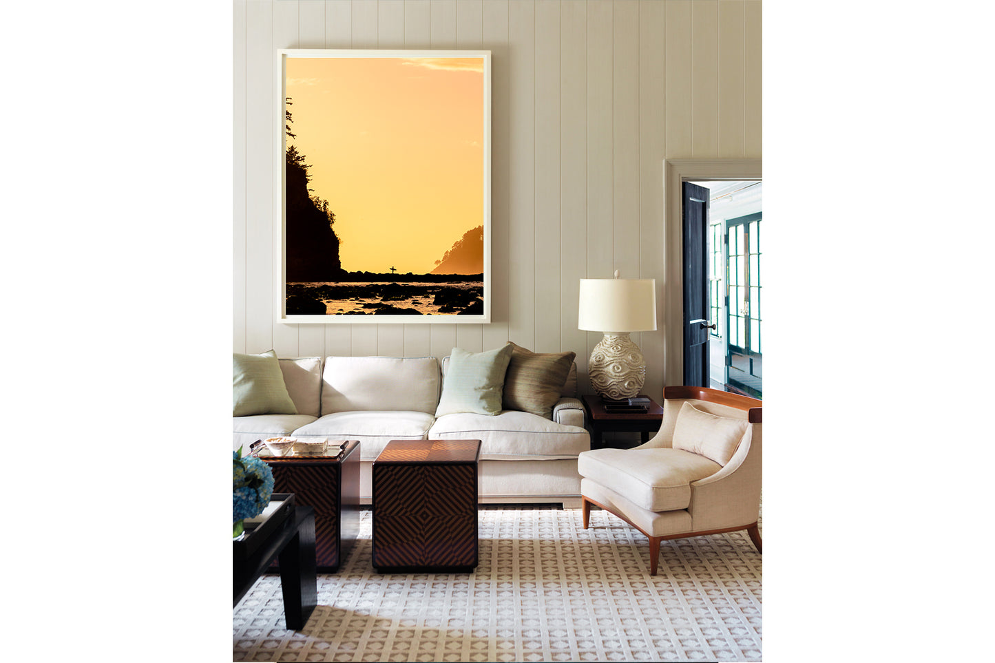 Hank's Heaven- A photograph by Mark McInnis in a white frame, above a white couch.