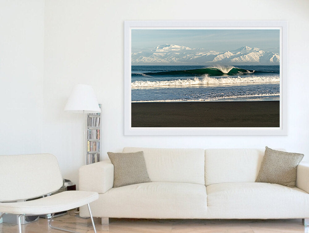Alaskan A-Frame- A photograph by Mark McInnis framed above a white couch.
