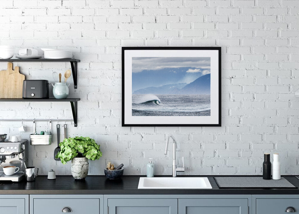 A Peak Peek- A photograph by Mark McInnis framed above the kitchen sink.