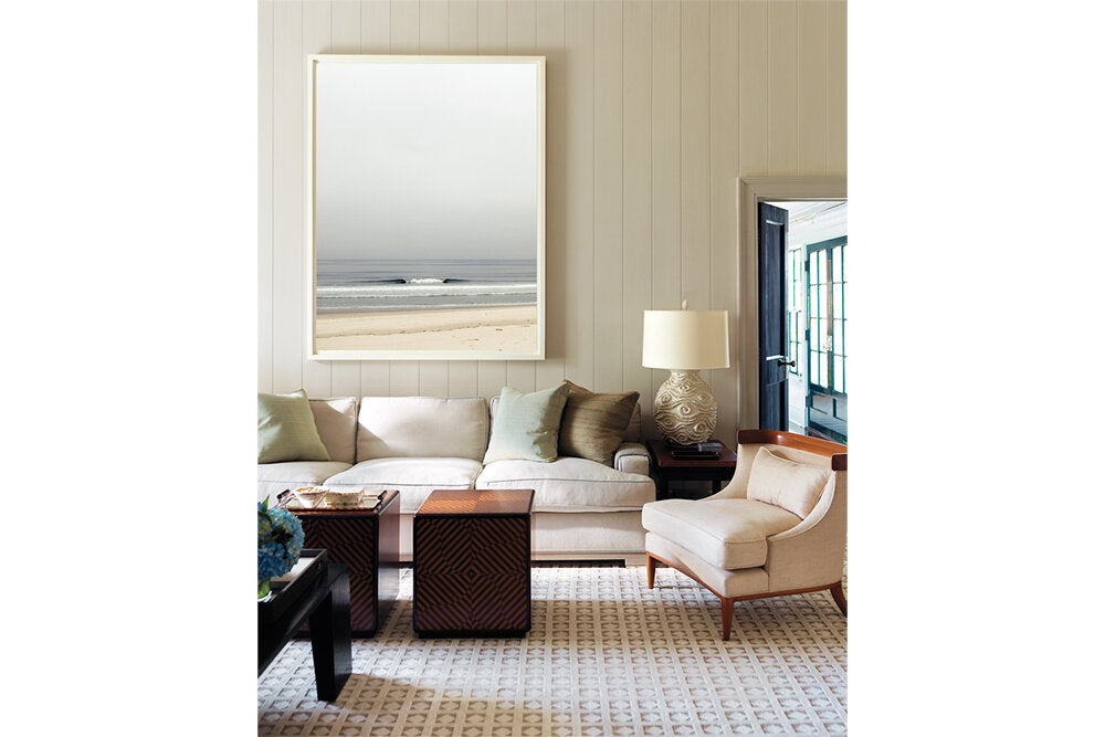 The Creek- A photograph by Mark McInnis above a couch.