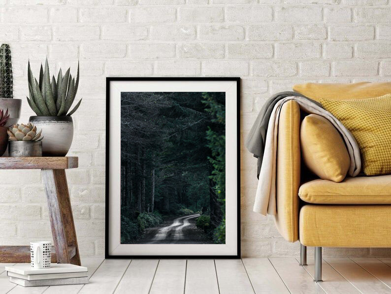 Pavement is Overrated- A photograph by Mark McInnis in a black frame, leaning against a white brick wall.