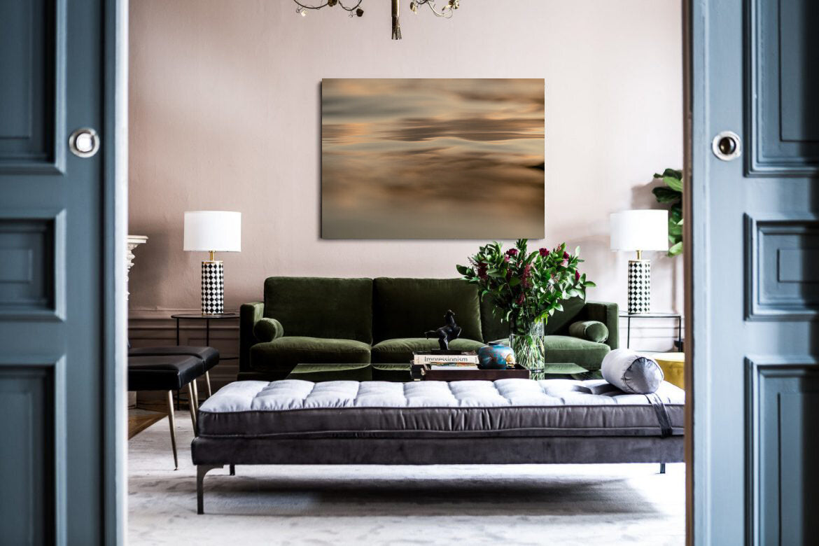 Slim to None- A photograph by Mark McInnis above a green couch.