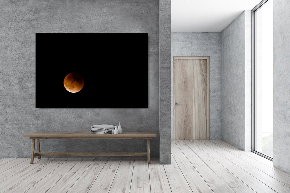 Blood Moon- A photograph by Mark McInnis above a bench.