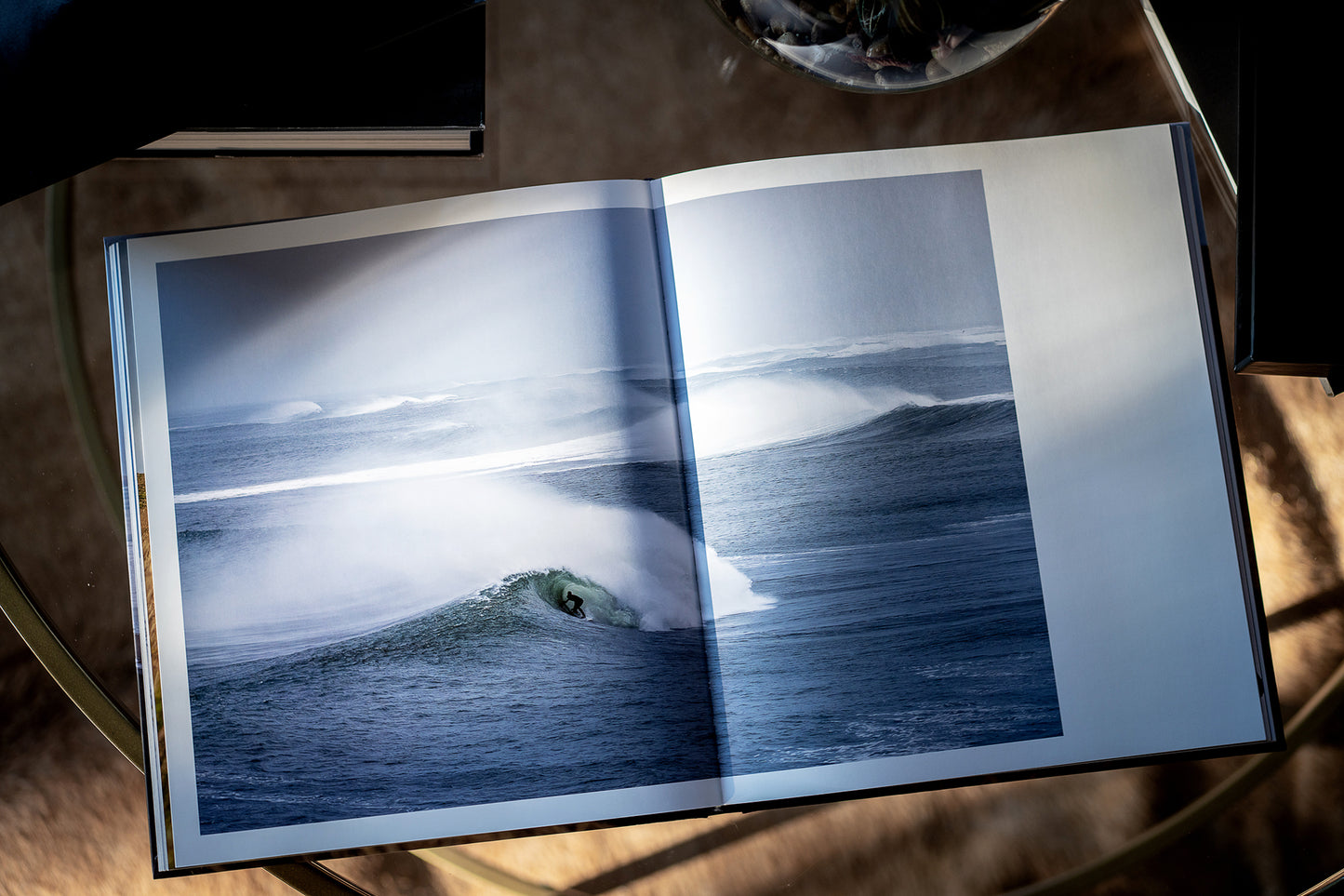 Island X- A photography book by Mark McInnis- Open to surfing photo.