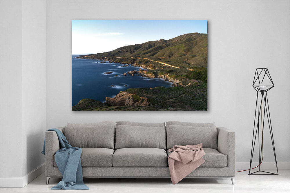 Californian Coast- A photograph by Mark McInnis above a couch.