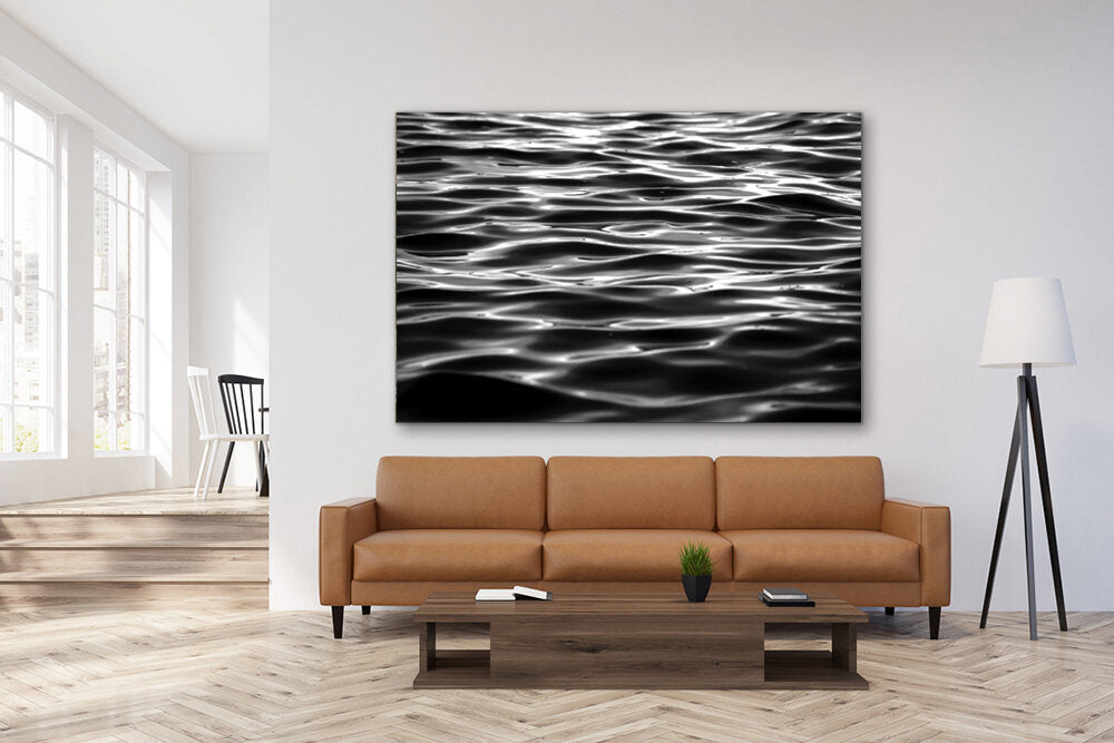 Oil Slick- A photograph by Mark McInnis above a couch. 