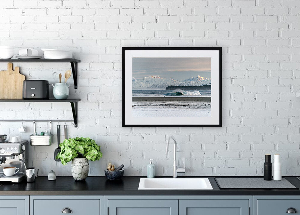 Just One More- A photograph by Mark McInnis in a black frame, above a kitchen sink.