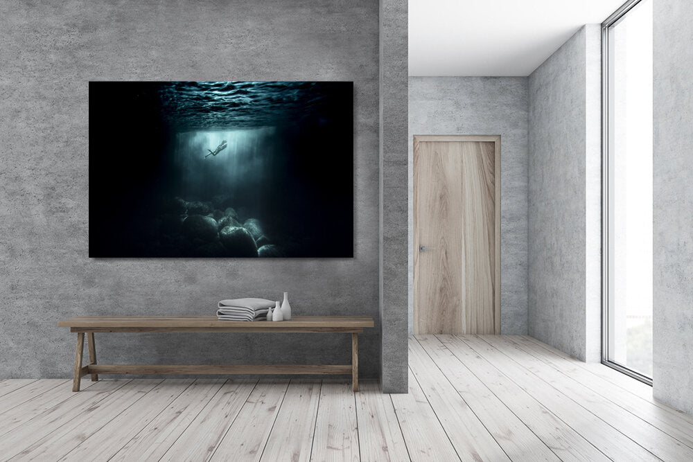 Underwater Paradise, a fine art print photo by Mark McInnis hung over a bench.