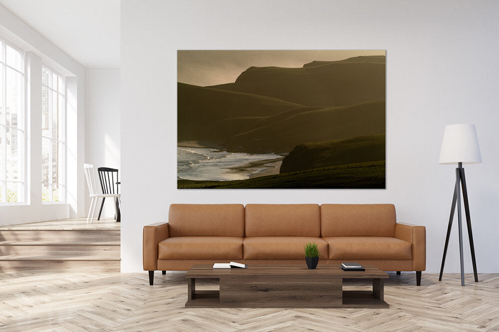 Ethereal Coast- A photograph by Mark McInnis above a brown couch.