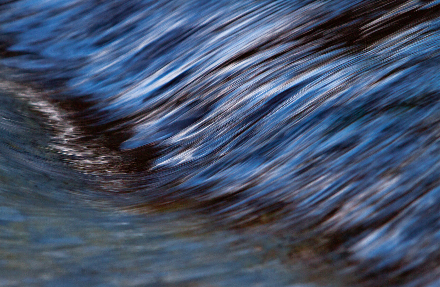 River Wave- A photograph by Mark McInnis. 